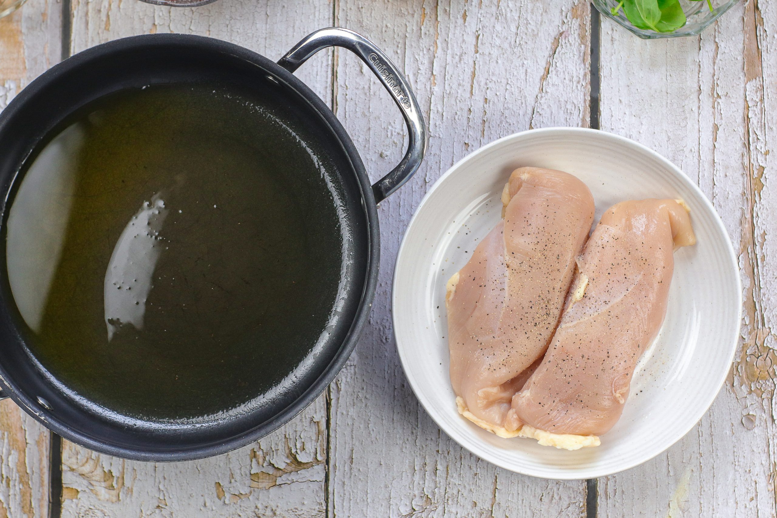 Chicken next to a pan