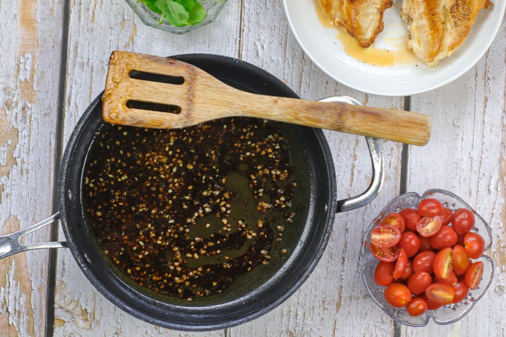 balsamic vinegar and garlic in a pan cooking. 