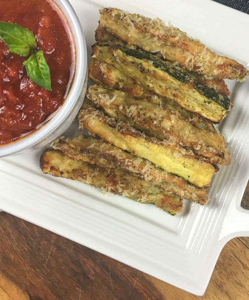 crispy zucchini fries on a white plate