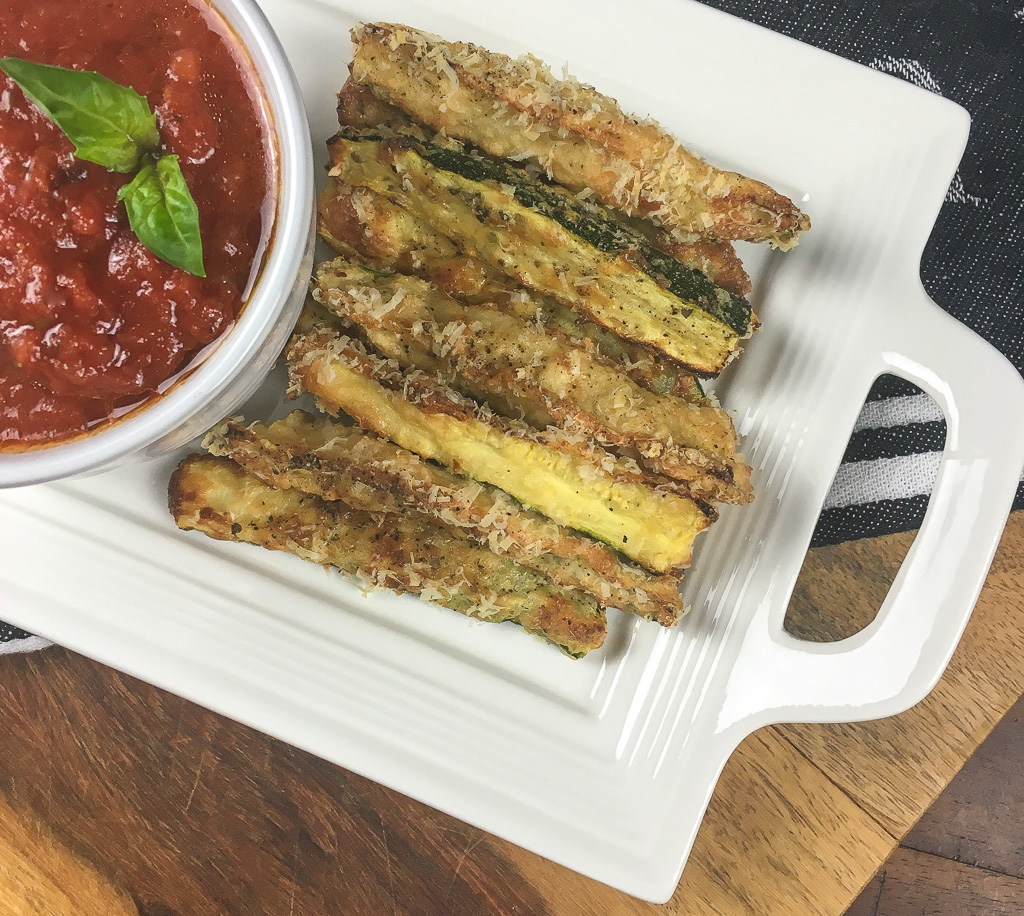 zucchini fries on a white plate