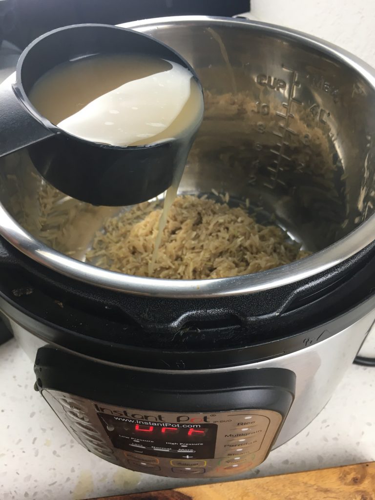 adding ingredients to make instant pot rice