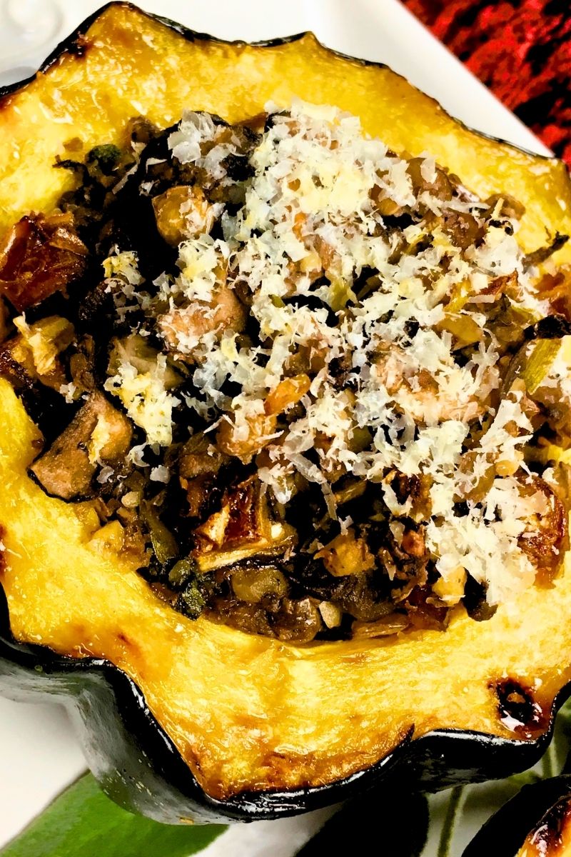 stuffed acorn squash on a white plate