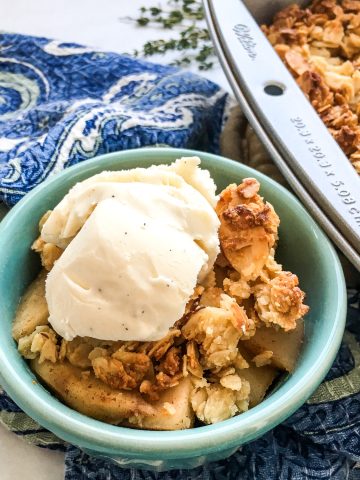 apple crisp with ice cream in a bowl