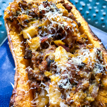 Apple Sausage Stuffed Butternut Squash with blue background