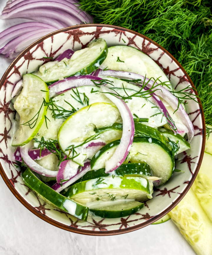 dill cucumber salad in a pretty bowl overhead shot