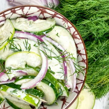 dill cucumber salad in a pretty bowl