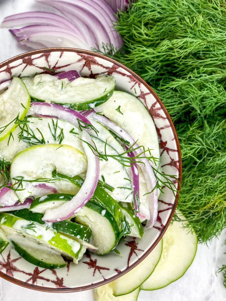 dill cucumber salad in a pretty bowl