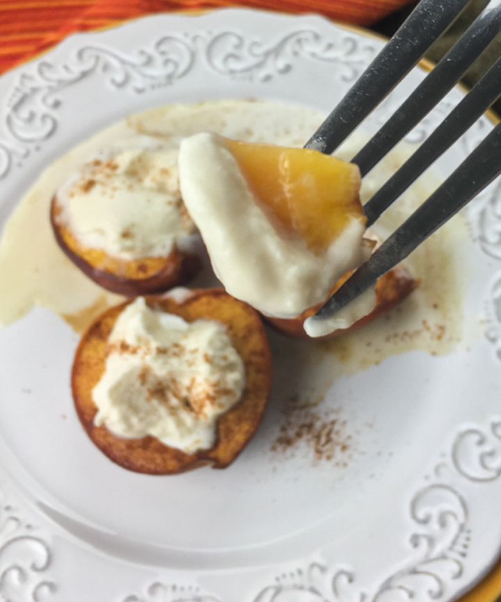 baked peaches with a bite on the fork