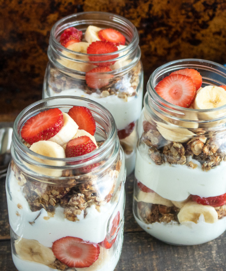 3 strawberry banana parfait with homemade granola in mason jars