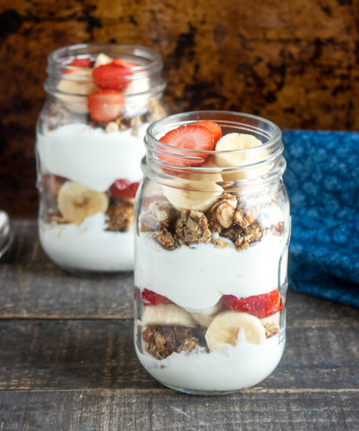 Strawberry Banana Parfait with Homemade Granola in mason jars