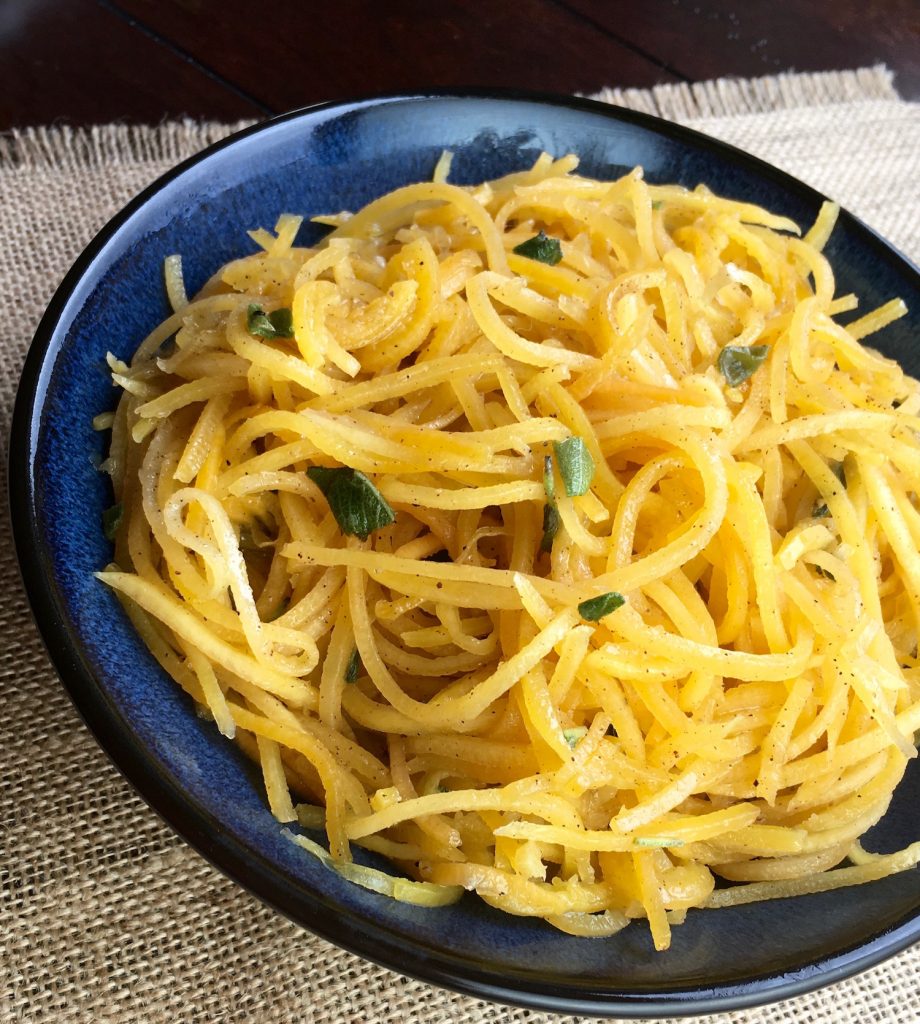 butternut squash noodles on a blue plate