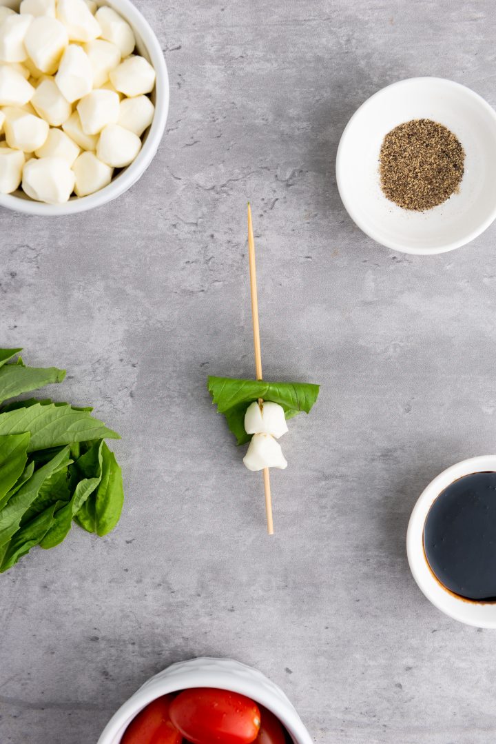 basil and cheese on a skewer