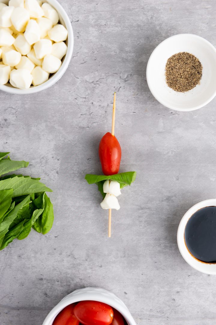 basil, cheese and tomato on a skewer