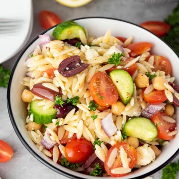 orzo pasta salad in a white bowl