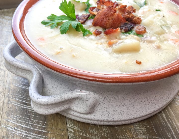 new england clam chowder in a brownish bowl