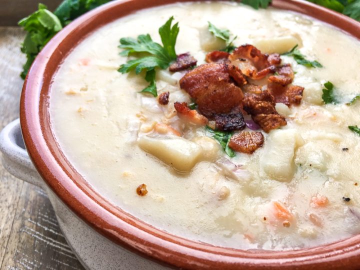 new england clam chowder in a brownish bowl