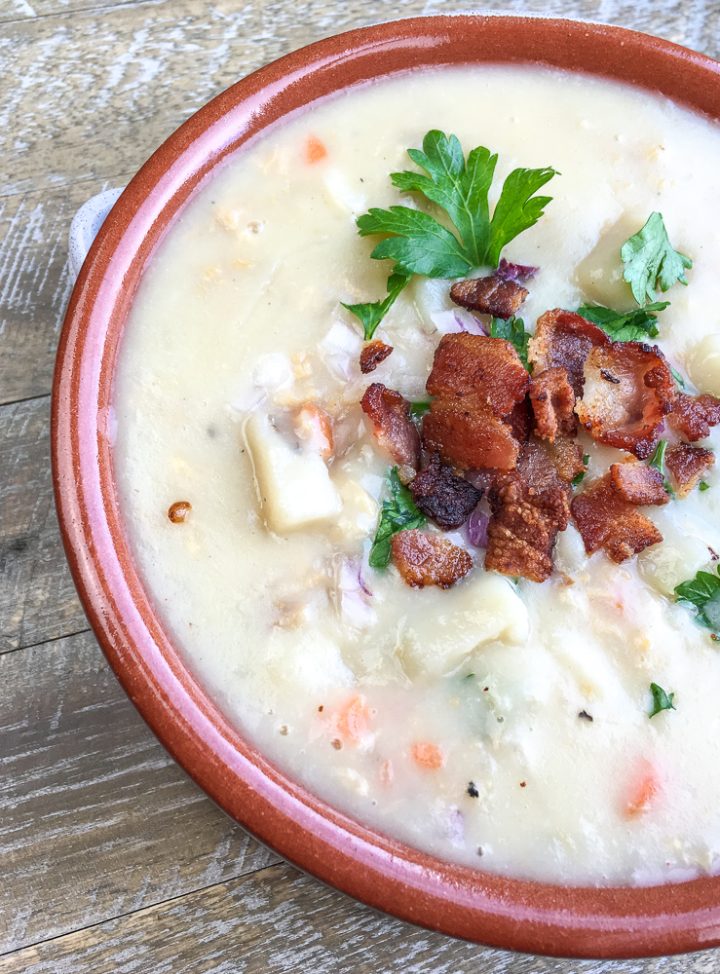 new england clam chowder in a brownish bowl