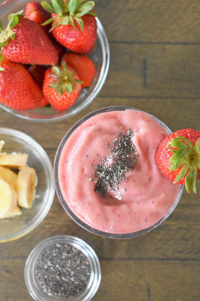 Strawberry Mango Smoothie on a brown table.