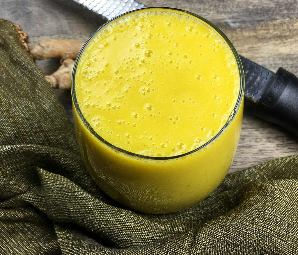 The Tropical Breakfast Smoothie on a green cloth.