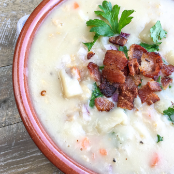 new england clam chowder in a brownish bowl