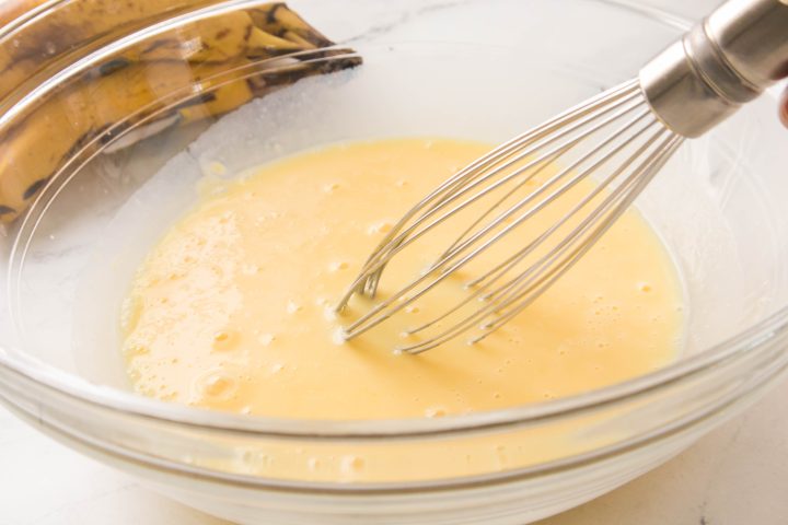 milk and instant pudding being mixed 