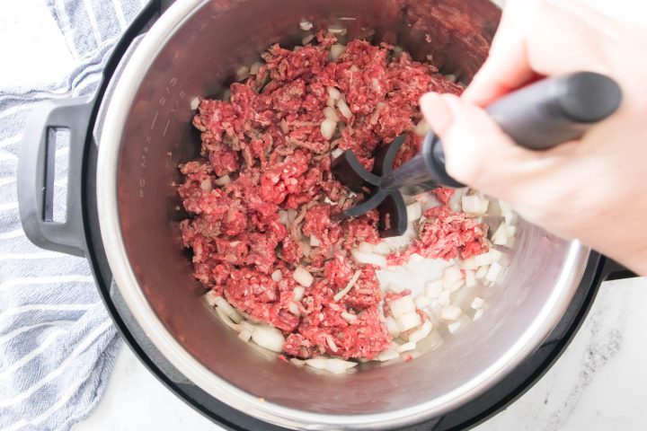 cooking ground beef in the pot