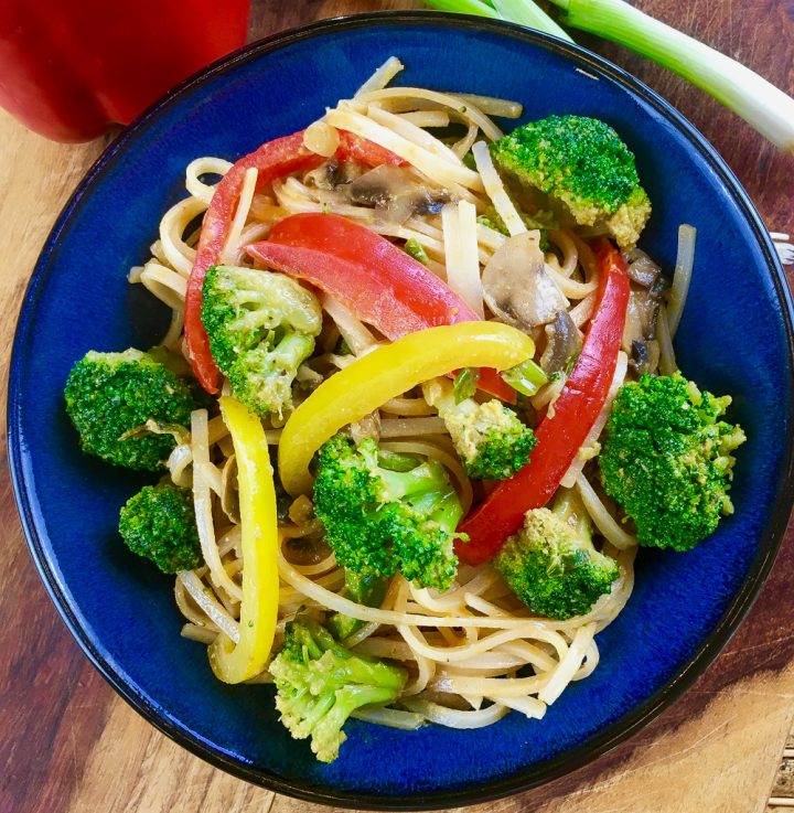 spicy noodles in a blue bowl