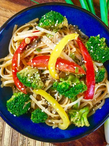 spicy noodles in a blue bowl