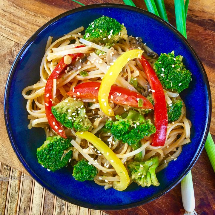 spicy noodles in a blue bowl